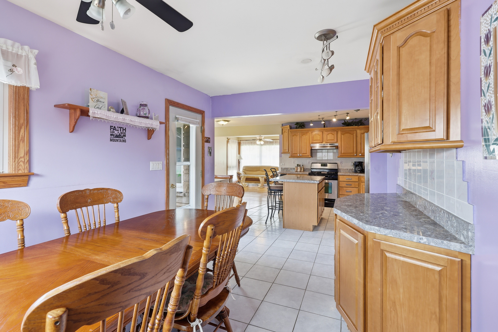 329 East Myrick Avenue Addison, IL 60101 - Photo 7 of 30 a kitchen with a dining table chairs and refrigerator