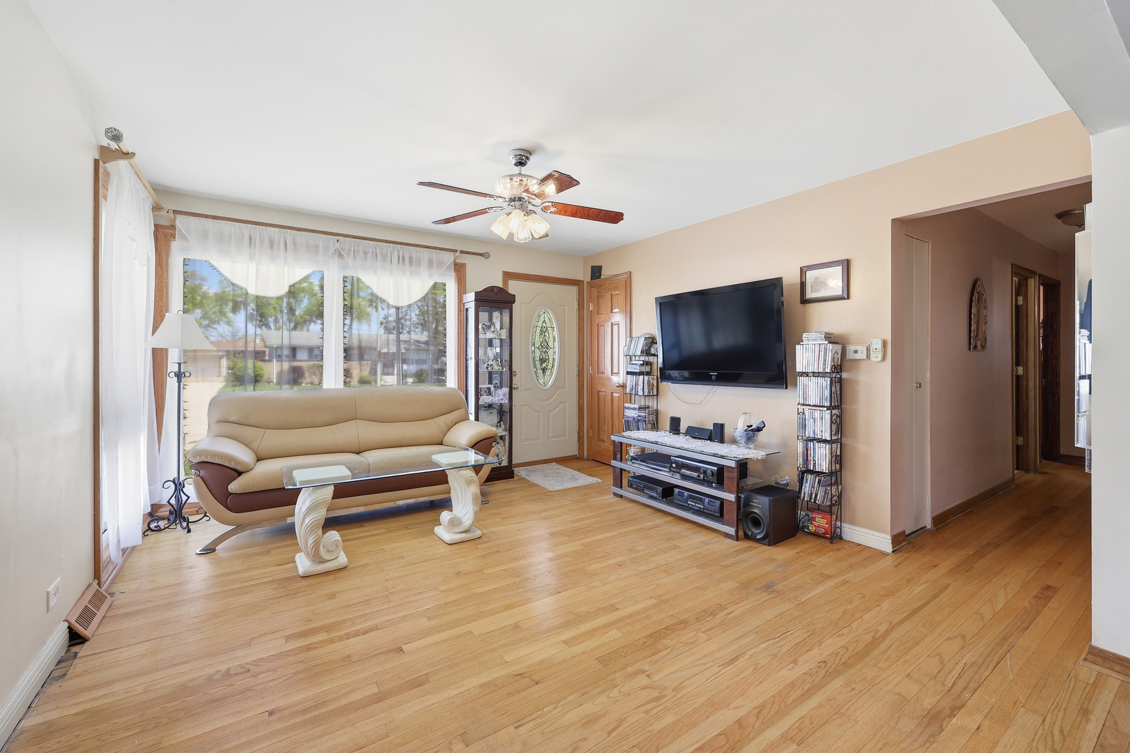 329 East Myrick Avenue Addison, IL 60101 - Photo 9 of 30 a living room with furniture and a flat screen tv