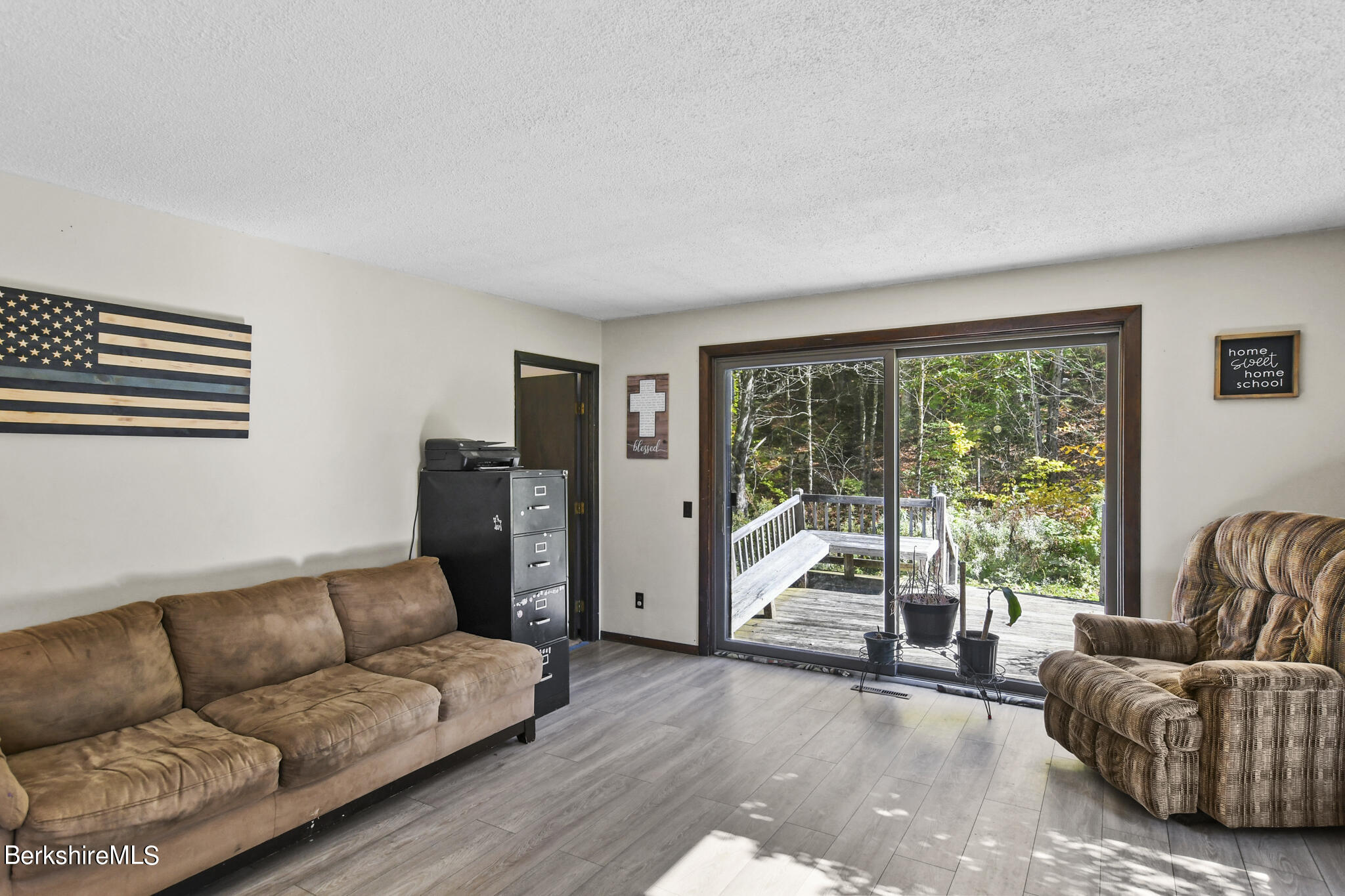 74 Old Main Road Savoy, MA 01256 - Photo 20 of 42 a living room with furniture and a large window