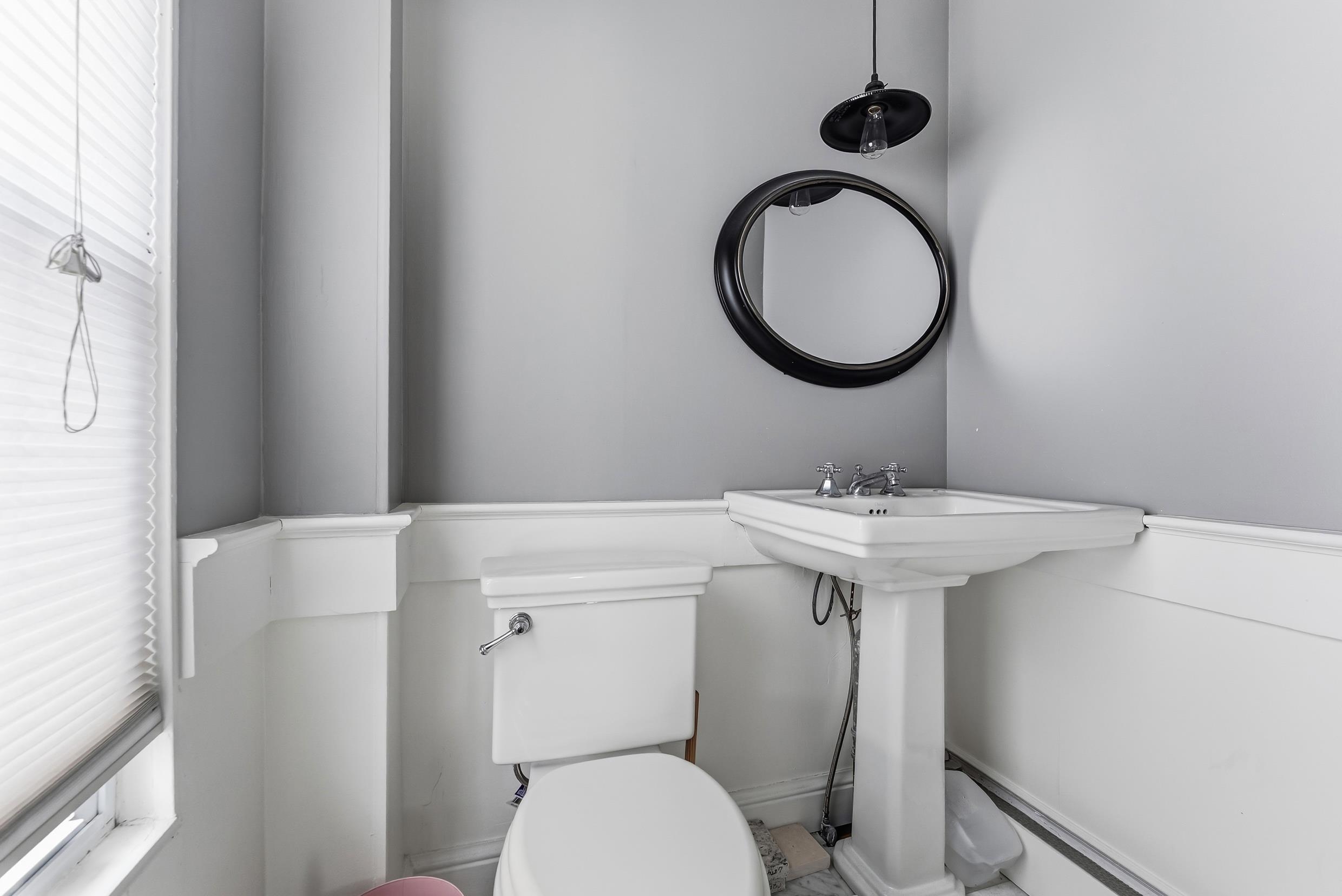 9727 3rd, Unit A1 Stone Harbor, NJ 08247 - Photo 12 of 20 a bathroom with a sink mirror toilet and a mirror