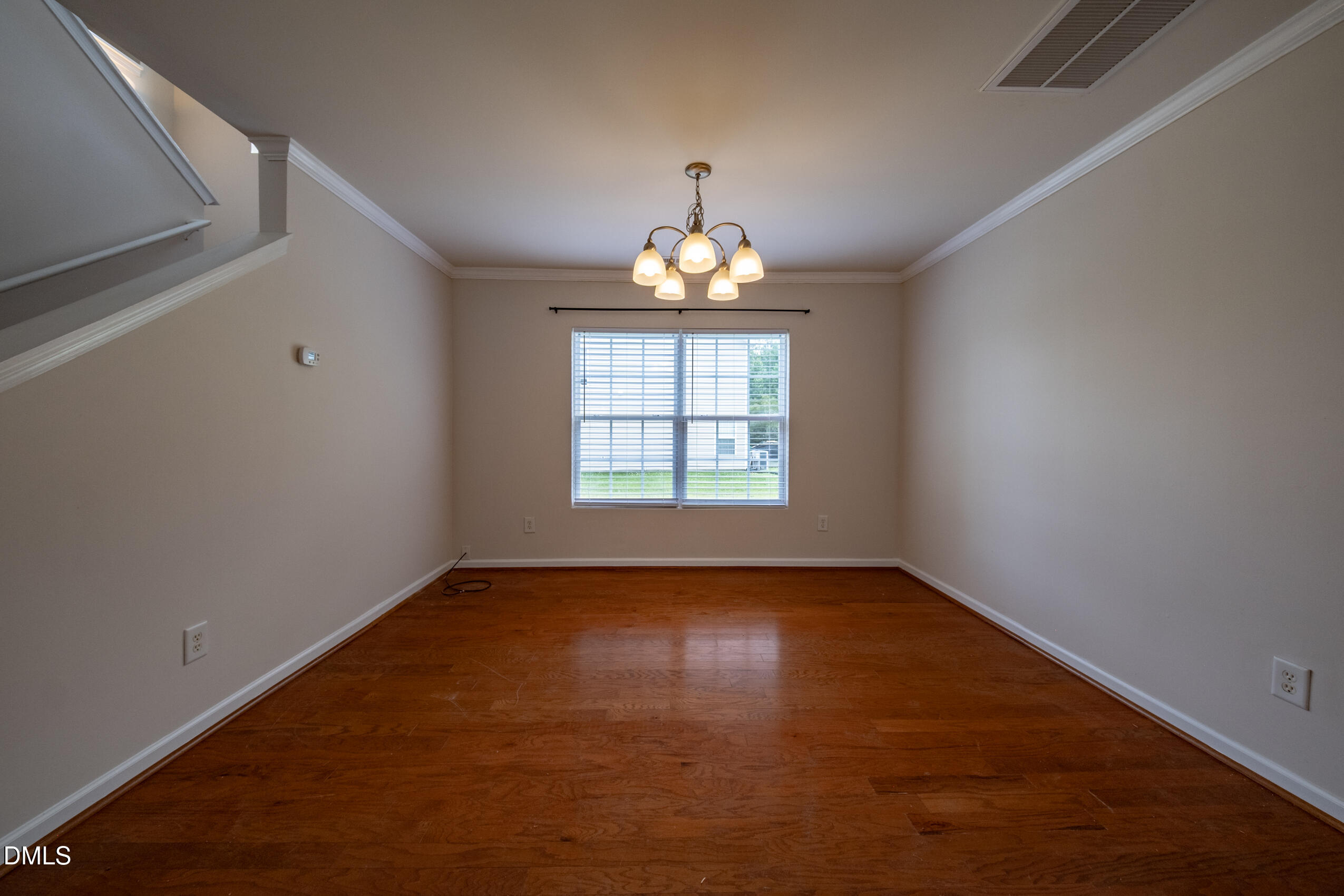 719 Obsidian Way Durham, NC 27703 - Photo 8 of 41 wooden floor in an empty room with a window