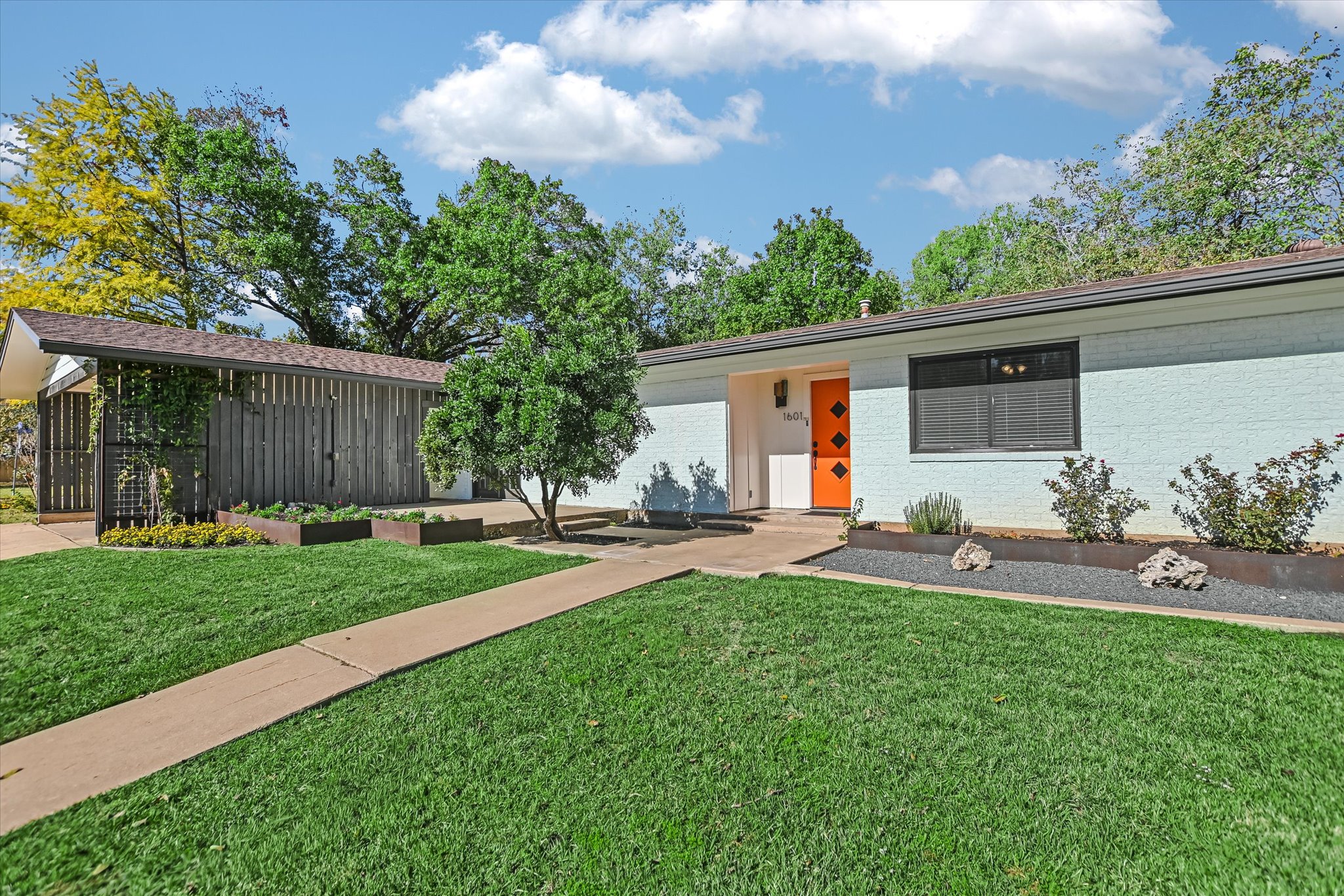1601 East 19th Street Georgetown, TX 78626 - Photo 2 of 31 a house view with a garden space and street view