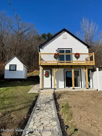 a front view of a house with garden