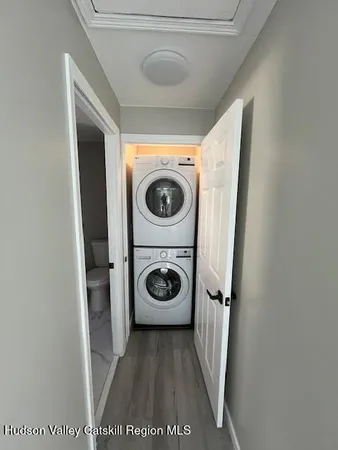 a bathroom with a bathtub sink and window