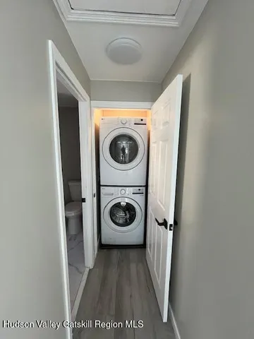 a bathroom with a bathtub sink and window