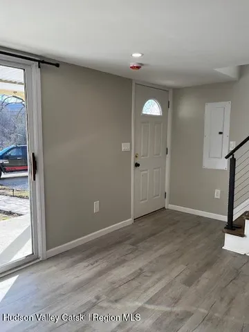 a view of a livingroom with wooden floor