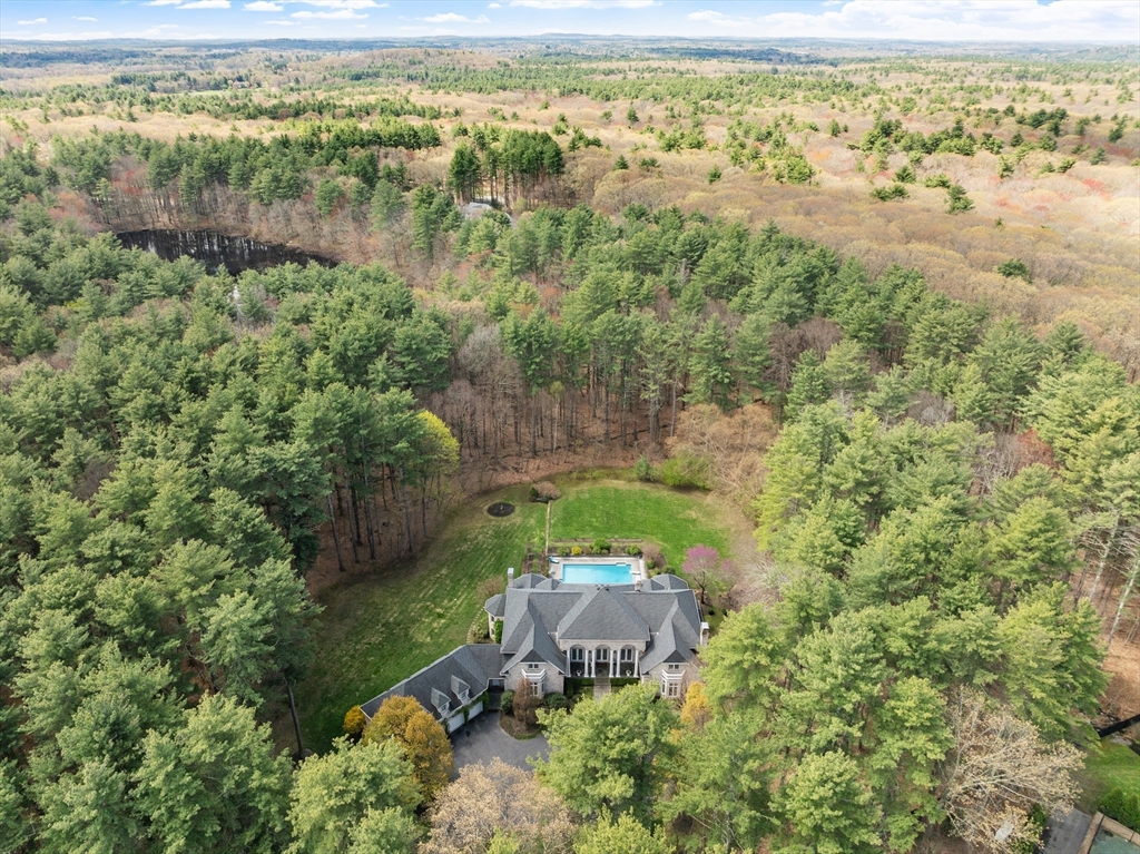 215 Monument Farm Road Concord, MA 01742 - Photo 42 of 42 a view of a lake with a yard