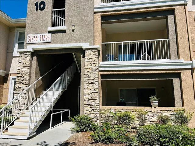 a view of a house with a door and a window
