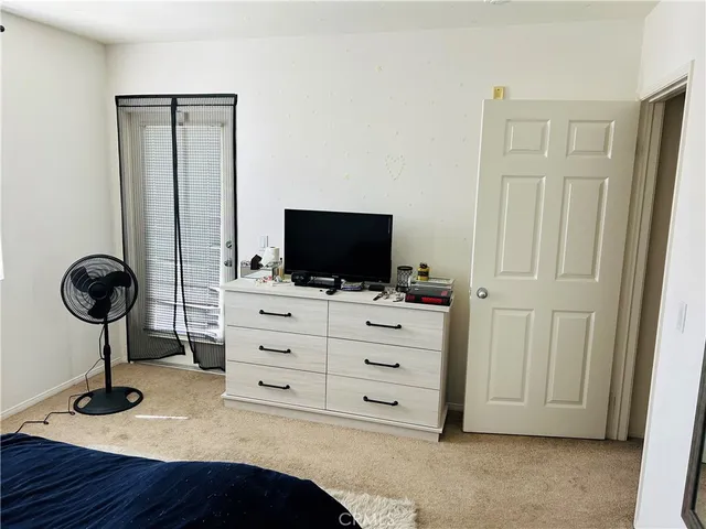 a view of room with furniture and flat screen tv