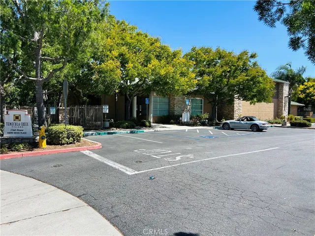 a view of street with parked cars