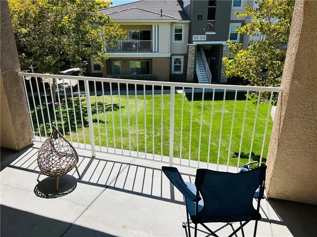 a view of a chairs and table on the deck