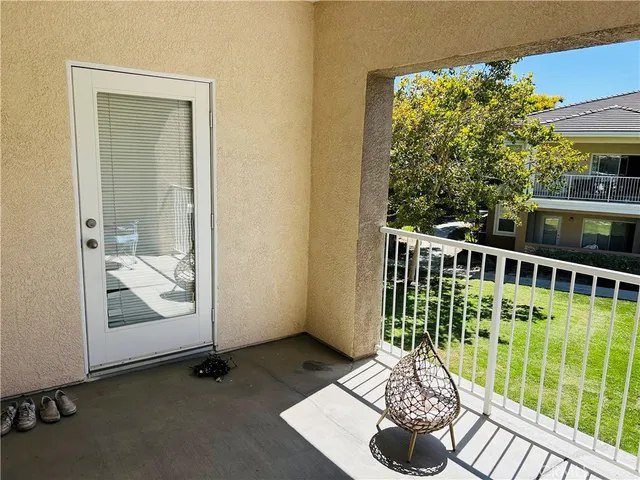 a view of balcony with furniture