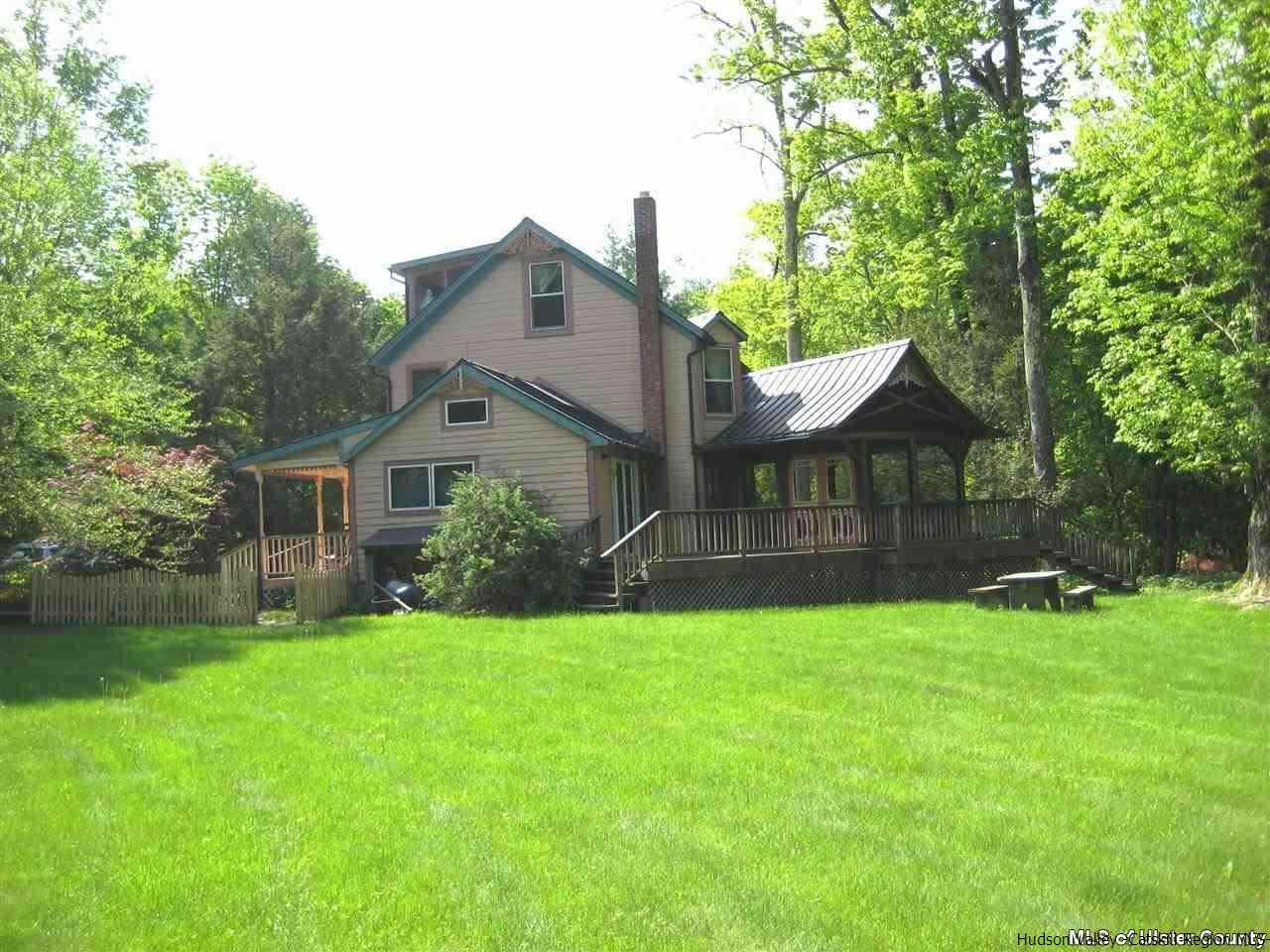 17 Cross Patch Road Woodstock, NY 12495 - Photo 1 of 35 a front view of house with yard and green space