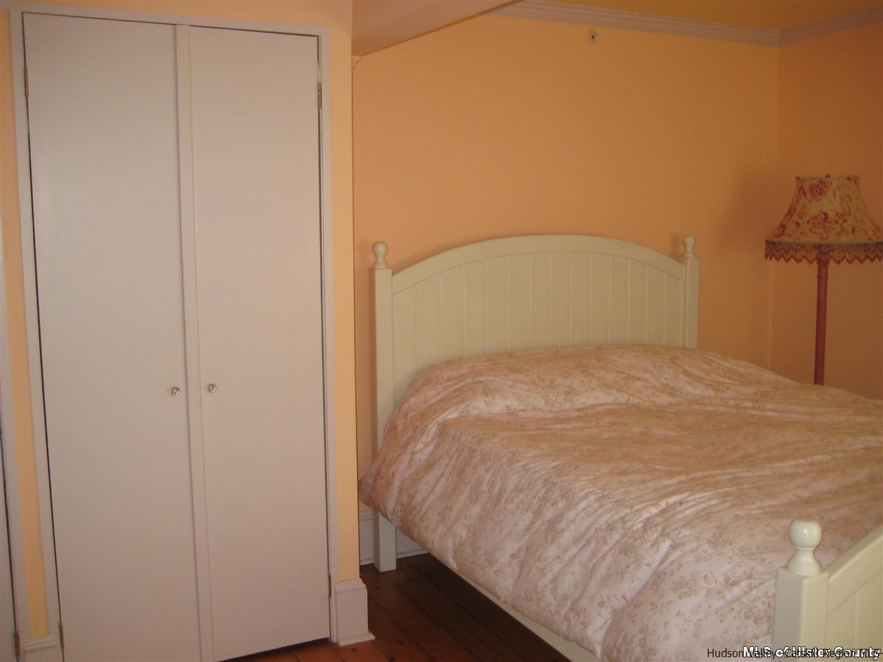 17 Cross Patch Road Woodstock, NY 12495 - Photo 17 of 35 a bed sitting in a bedroom next to a bathroom