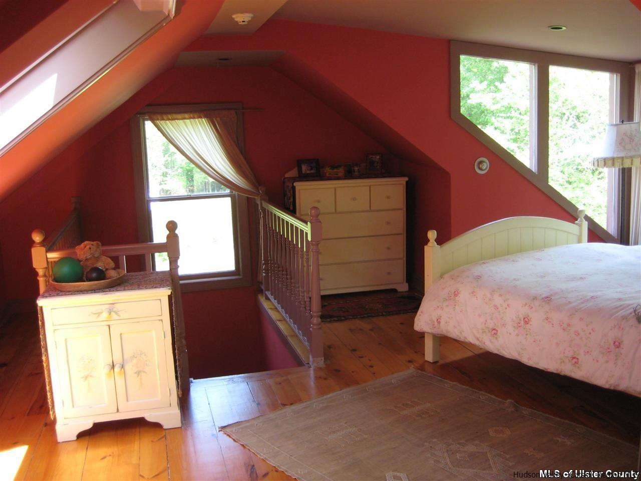 17 Cross Patch Road Woodstock, NY 12495 - Photo 22 of 35 a bedroom with a bed and wooden floor