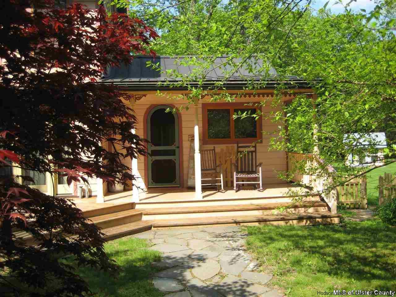 17 Cross Patch Road Woodstock, NY 12495 - Photo 5 of 35 a view of a house with a small yard plants and a large tree