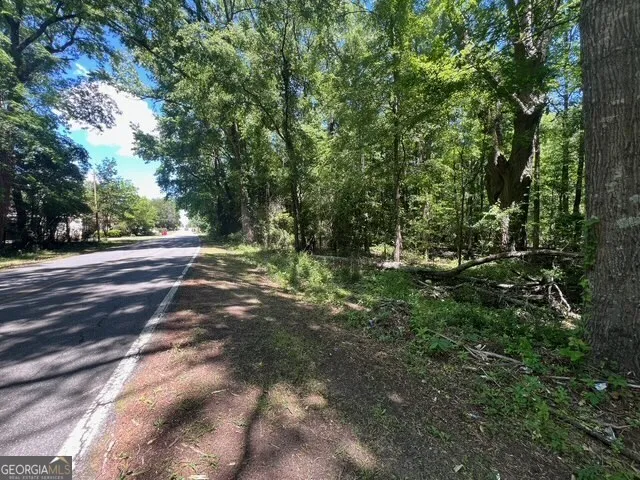 a view of outdoor space with trees all around
