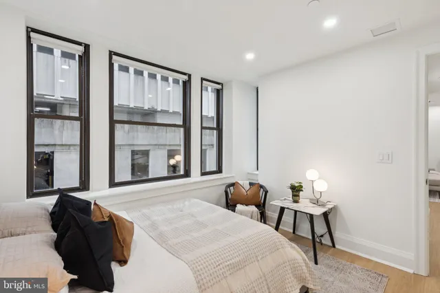 a bed room with a bed and a window