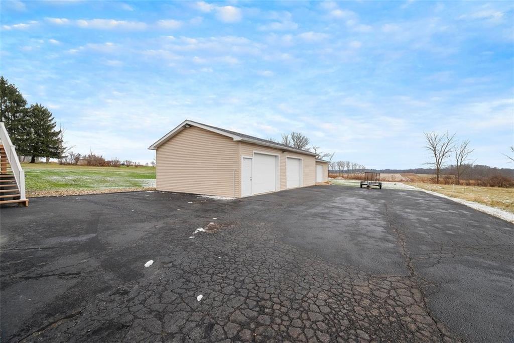 1219 Prospect Road Prospect, PA 16052 - Photo 29 of 44 24x64 detached, 3-stall heated garage with (2) tall garage doors