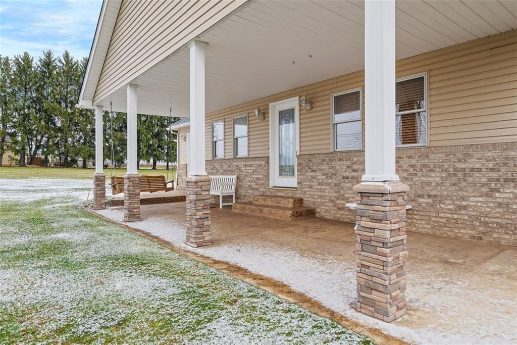 1219 Prospect Road Prospect, PA 16052 - Photo 3 of 44 Relax on the covered front porch with stamped concrete floor