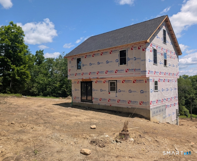a front view of a house with a yard