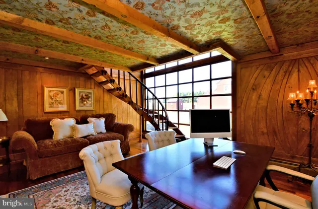 a view of a dining room with furniture wooden floor and a chandelier