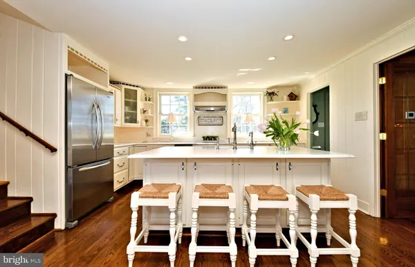 a dining room with furniture and wooden floor