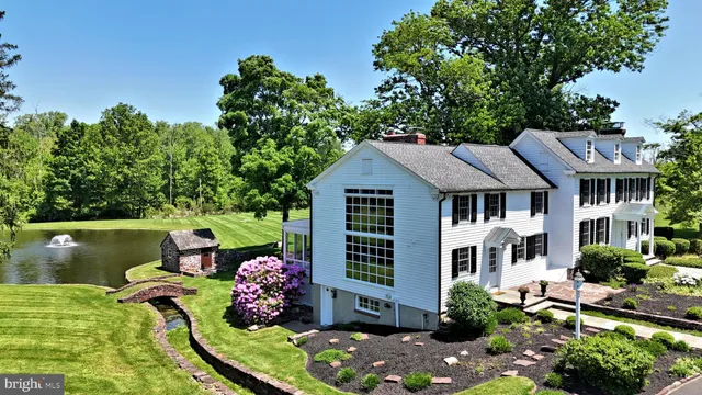 a front view of a house with a yard table and chairs