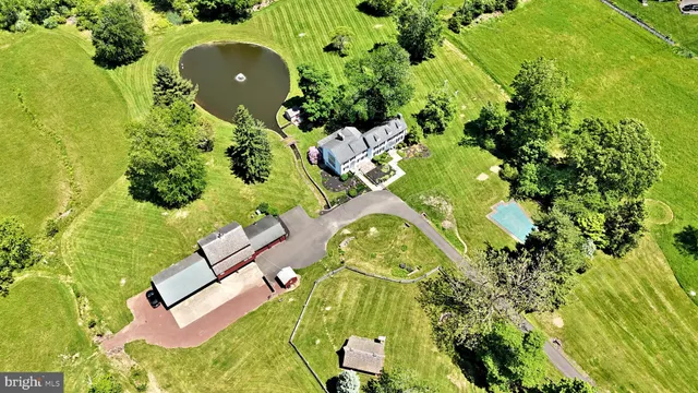 a kitchen with a sink a counter top space and living room view