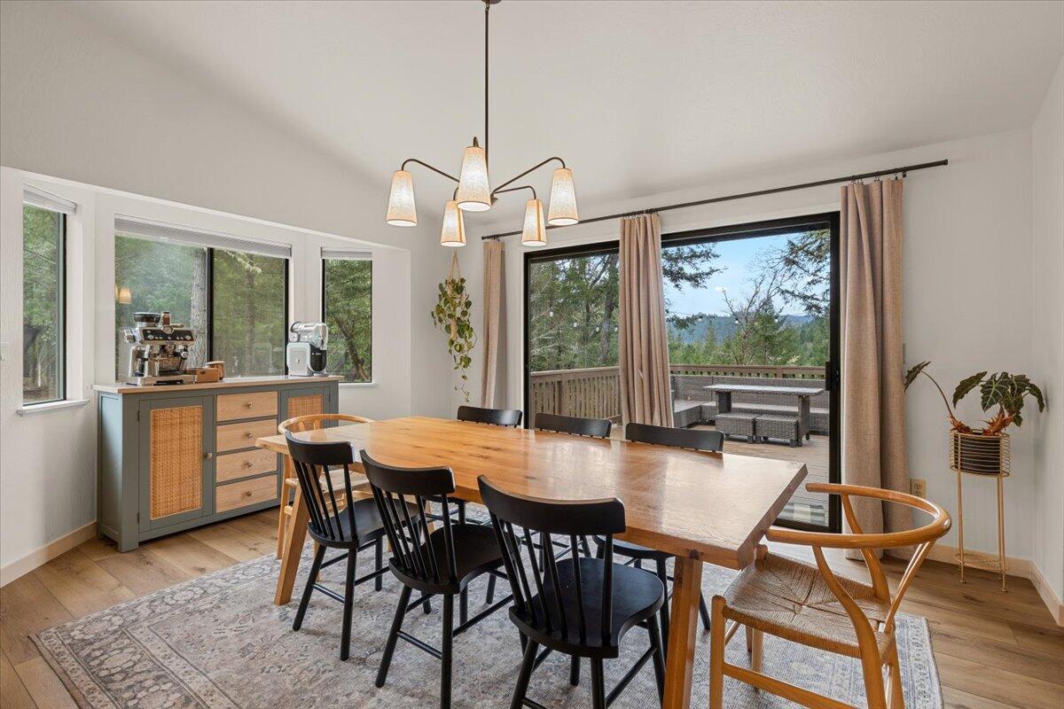 350 Splendor Drive Wilderville, OR 97543 - Photo 14 of 57 a view of a dining room with furniture window and outside view