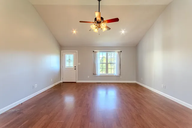 a kitchen with stainless steel appliances granite countertop wooden cabinets stove top oven and sink