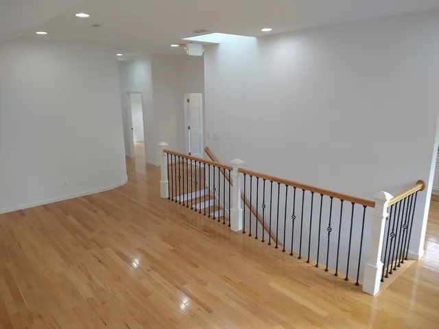 a view of a hallway with staircase