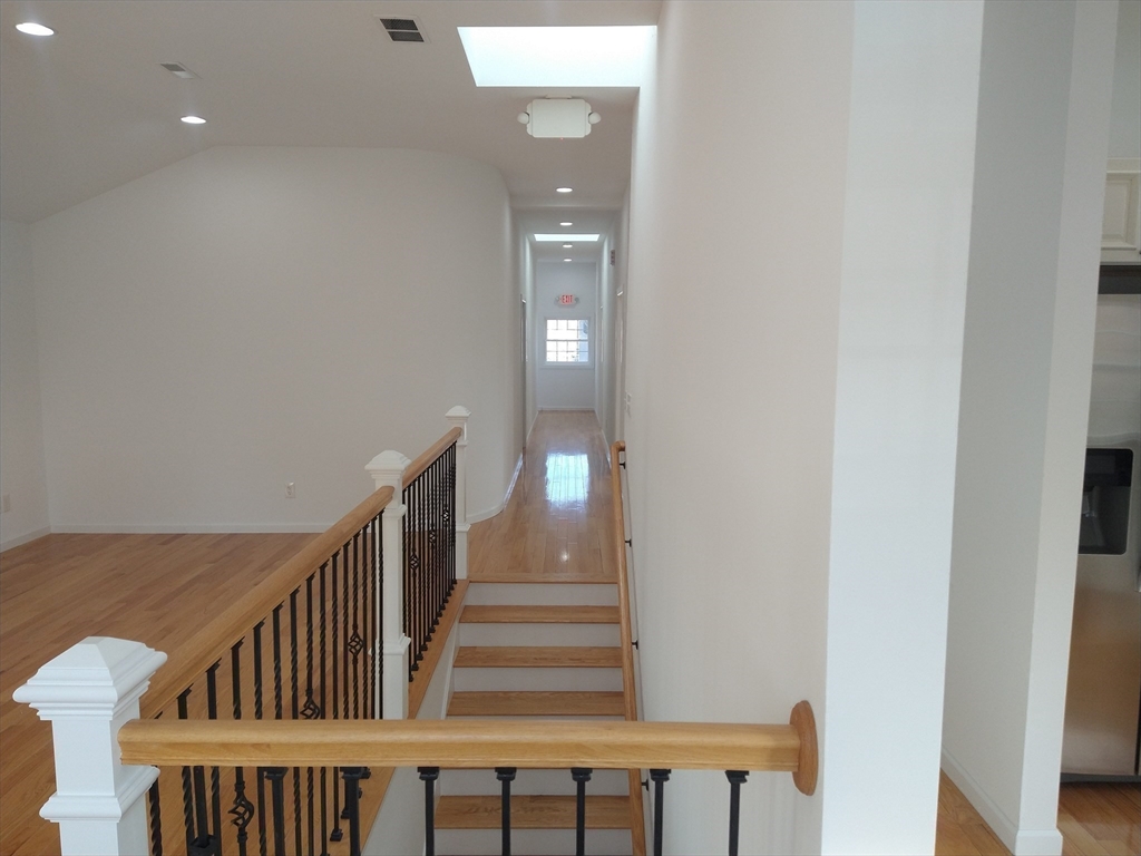 26 Russell Street, Unit AB Hadley, MA 01035 - Photo 12 of 42 a view of a hallway with staircase