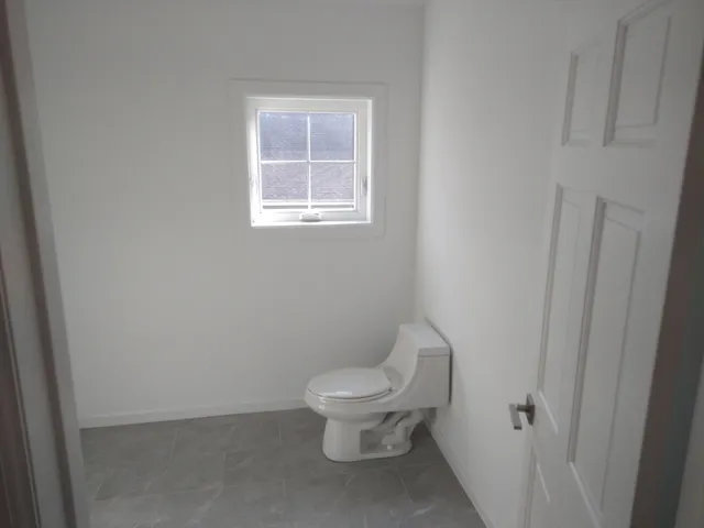 a bathroom with a sink vanity and mirror