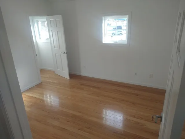 a view of an empty room with windows