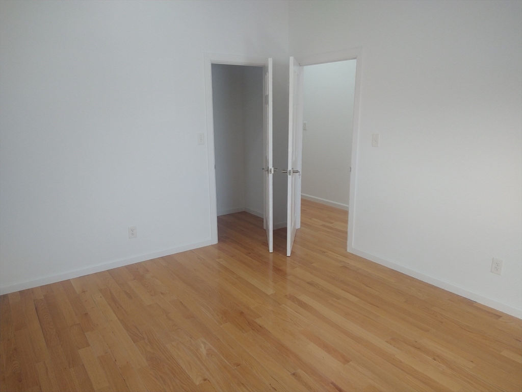 26 Russell Street, Unit AB Hadley, MA 01035 - Photo 20 of 42 a view of an empty room with wooden floor