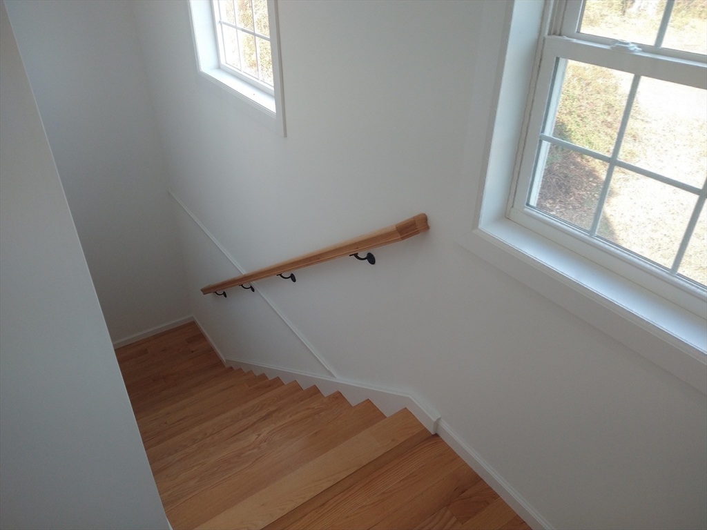 26 Russell Street, Unit AB Hadley, MA 01035 - Photo 24 of 42 a view of entryway and hall with wooden floor