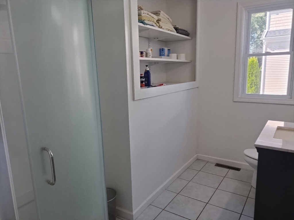 26 Russell Street, Unit AB Hadley, MA 01035 - Photo 37 of 42 a view of storage and utility room with a window