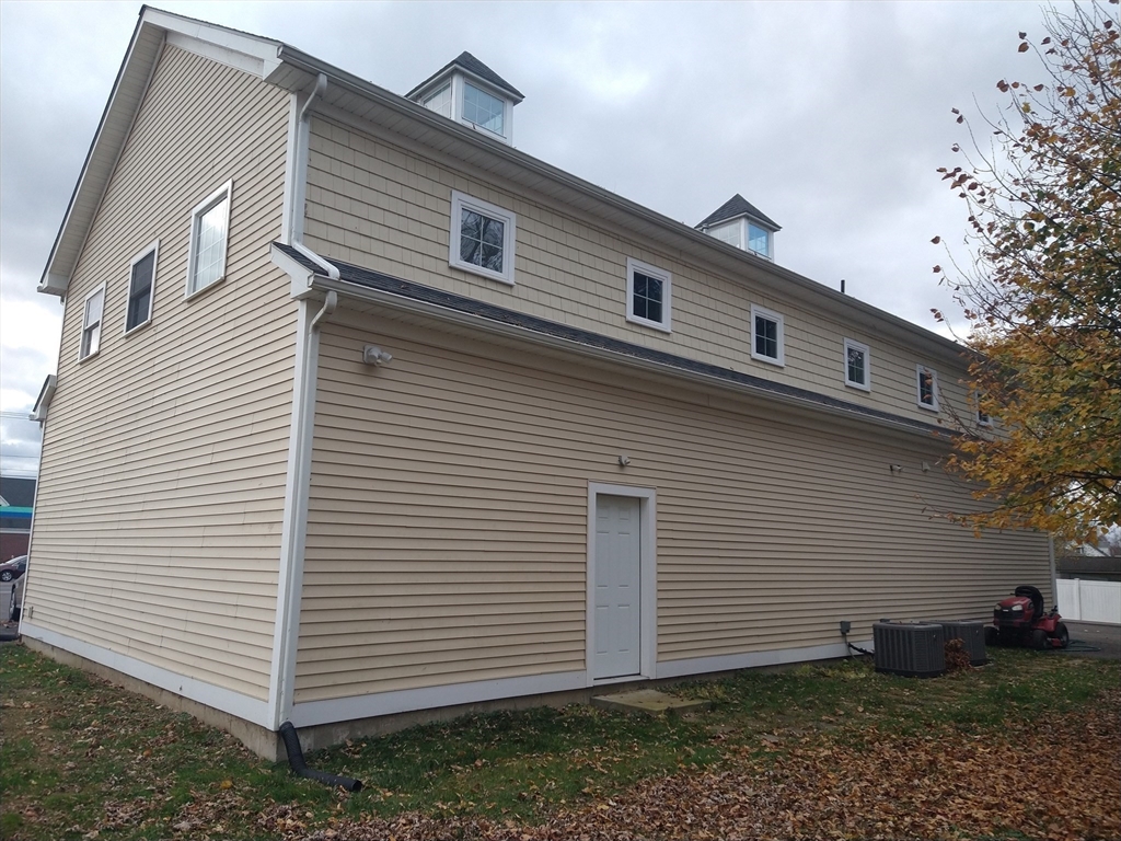 26 Russell Street, Unit AB Hadley, MA 01035 - Photo 5 of 42 a view of a white house next to a yard