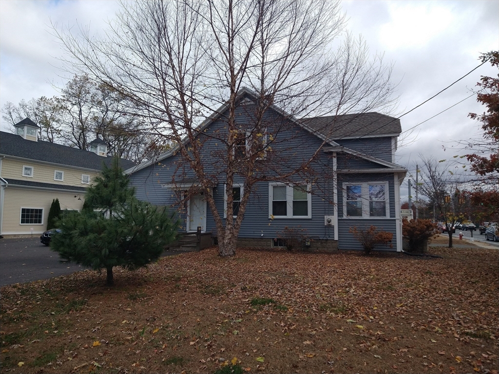 26 Russell Street, Unit AB Hadley, MA 01035 - Photo 9 of 42 a front view of a house with a yard