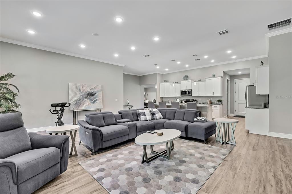 9504 Earthwind Court Weeki Wachee, FL 34613 - Photo 12 of 48 a living room with furniture and a view of kitchen