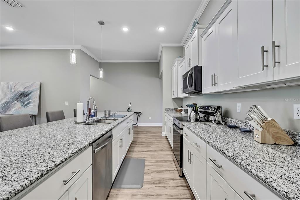 9504 Earthwind Court Weeki Wachee, FL 34613 - Photo 14 of 48 a kitchen with granite countertop lots of counter top space