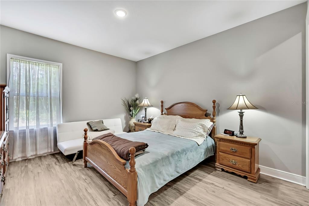9504 Earthwind Court Weeki Wachee, FL 34613 - Photo 23 of 48 a bedroom with bed and a window