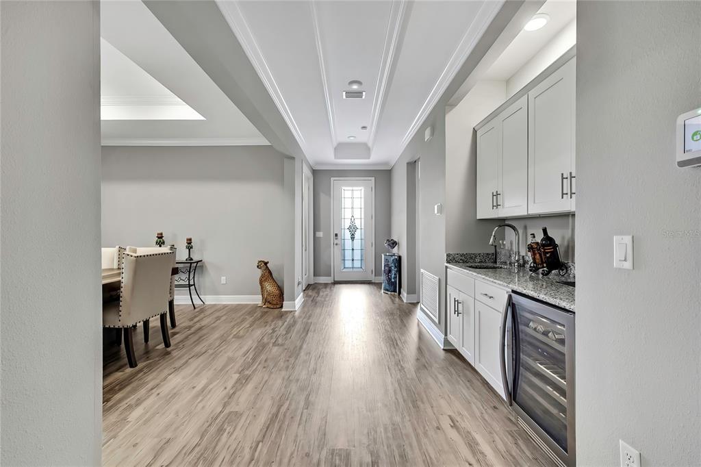 9504 Earthwind Court Weeki Wachee, FL 34613 - Photo 4 of 48 a kitchen with a sink and wooden floors