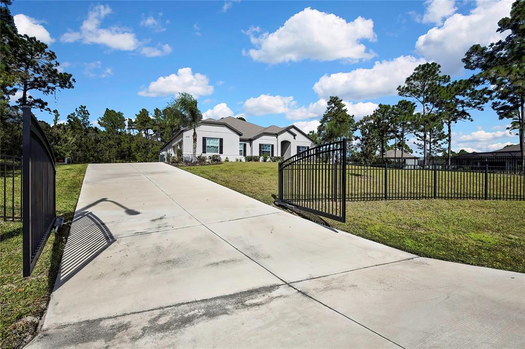 9504 Earthwind Court Weeki Wachee, FL 34613 - Photo 46 of 48 a view of a garden with a slide
