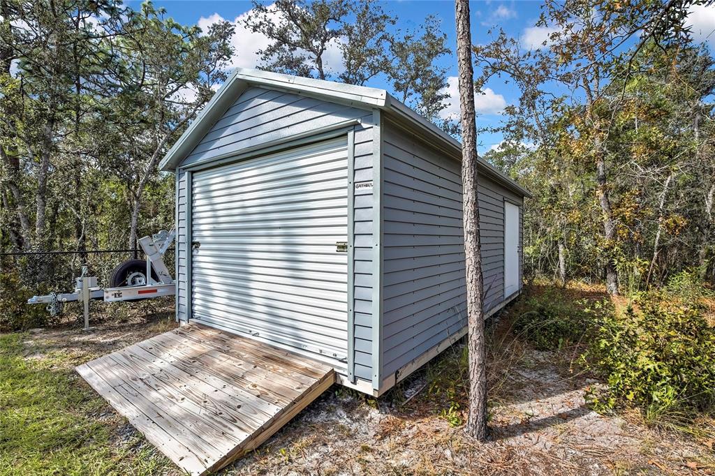 9504 Earthwind Court Weeki Wachee, FL 34613 - Photo 48 of 48 a view of backyard with a large tree