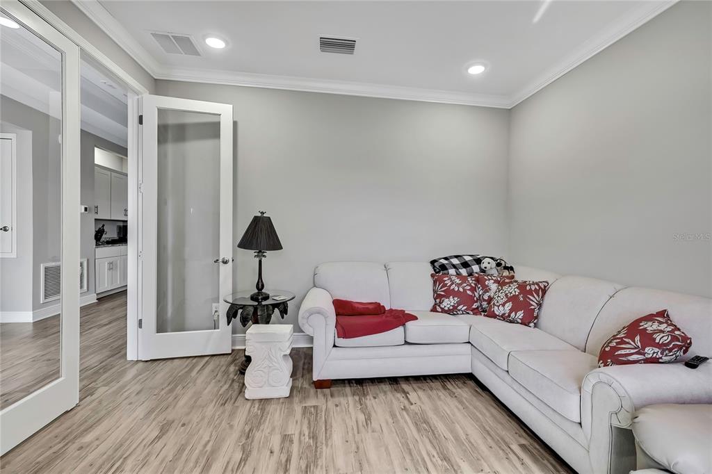 9504 Earthwind Court Weeki Wachee, FL 34613 - Photo 5 of 48 a living room with furniture and wooden floor