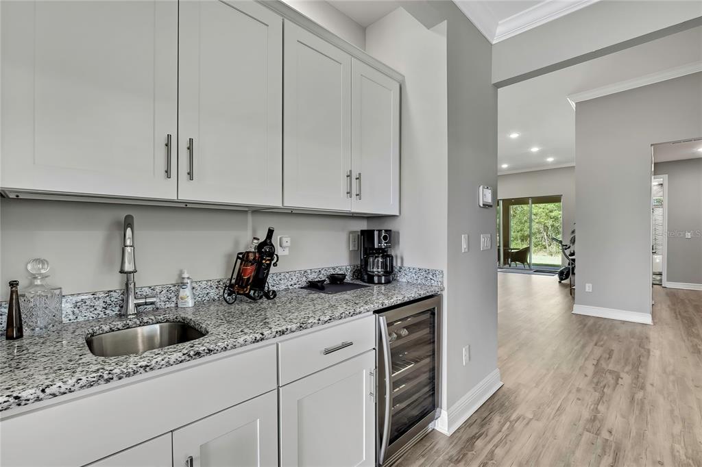 9504 Earthwind Court Weeki Wachee, FL 34613 - Photo 8 of 48 a kitchen with stainless steel appliances granite countertop a sink and cabinets
