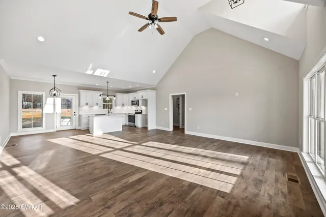 a view of a kitchen with a sink and cabinets