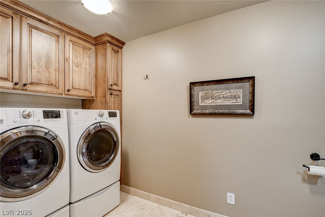 1950 Bowman Road Logandale, NV 89021 - Photo 44 of 81 Ample storage solutions in this well-appointed laundry space featuring wood cabinetry.